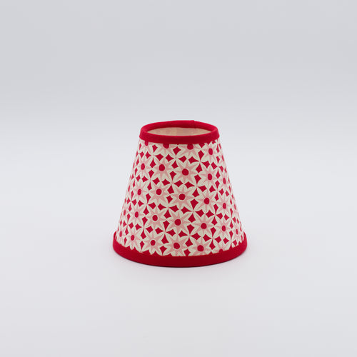 Alhambra lampshade in red and pink — geometric interlocking pattern on a handmade conical paper shade.
