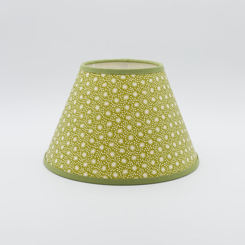 Animalcules lampshade in green — scattered organic speckle pattern on a handmade conical paper shade.