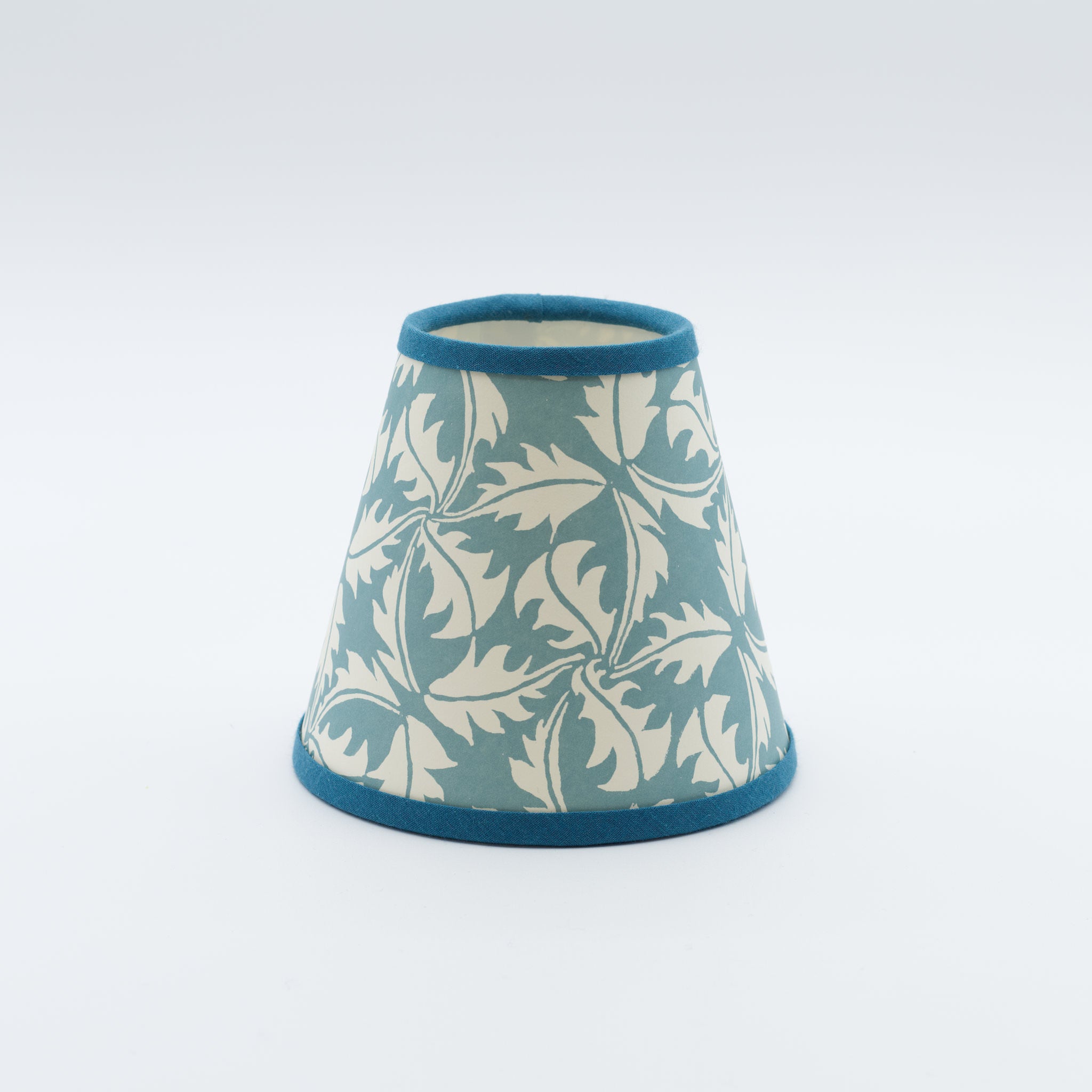 Dandelion lampshade in blue — dandelion seedhead pattern on a handmade conical paper shade.