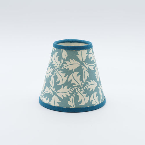 Dandelion lampshade in blue — dandelion seedhead pattern on a handmade conical paper shade.