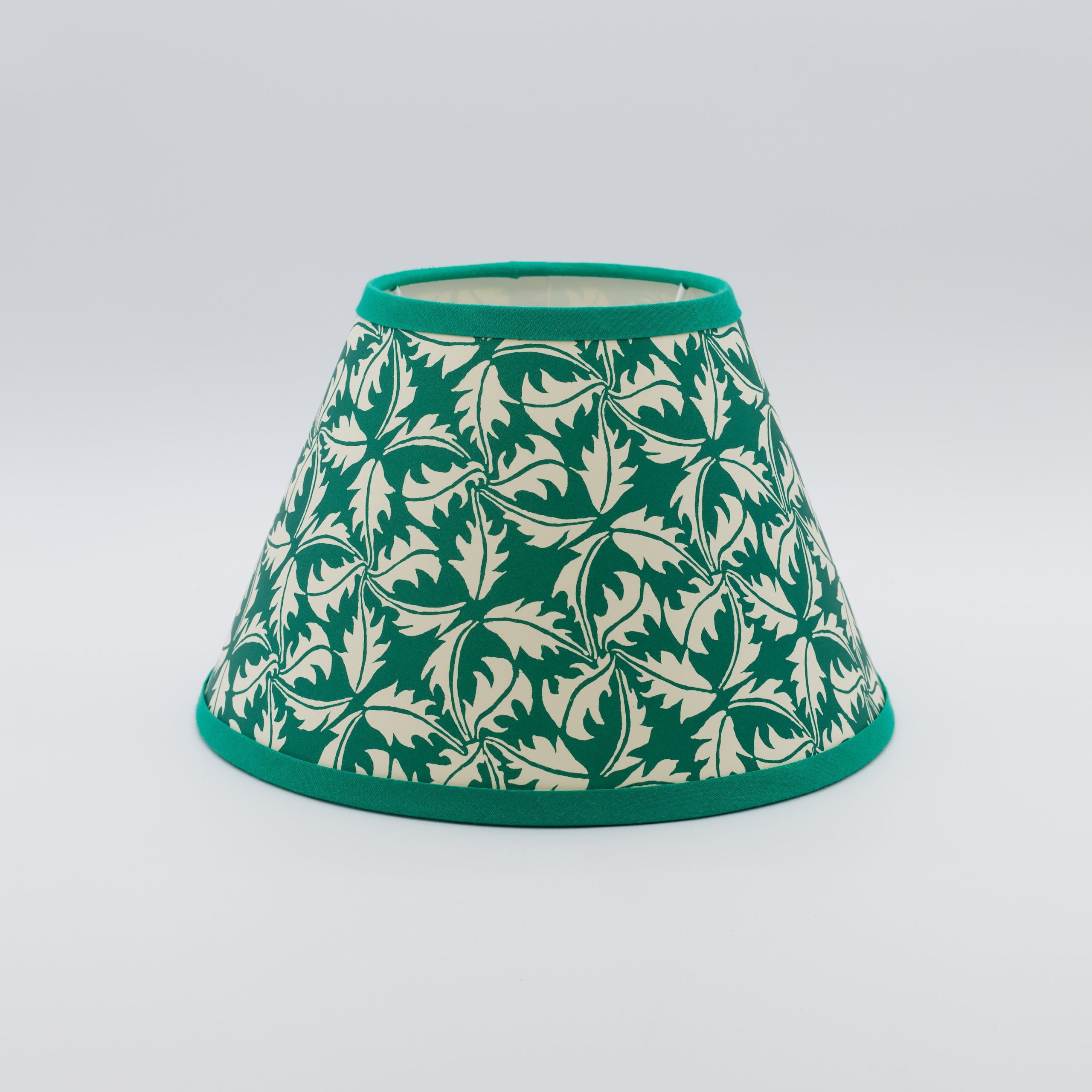 Dandelion lampshade in bottle green — dandelion seedhead pattern on a handmade conical paper shade.