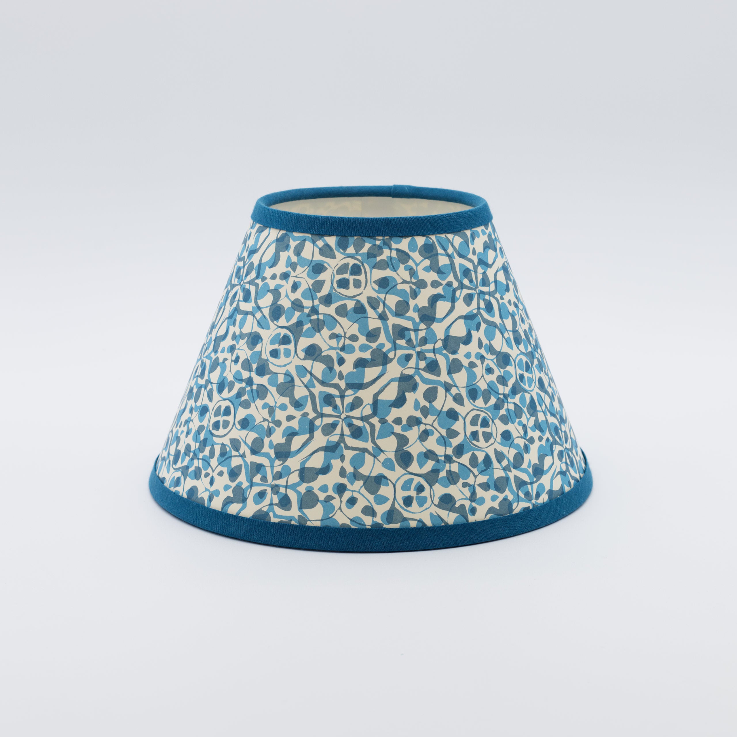 Dappled Blue lampshade — soft dappled spot texture in blue on a handmade conical paper shade.