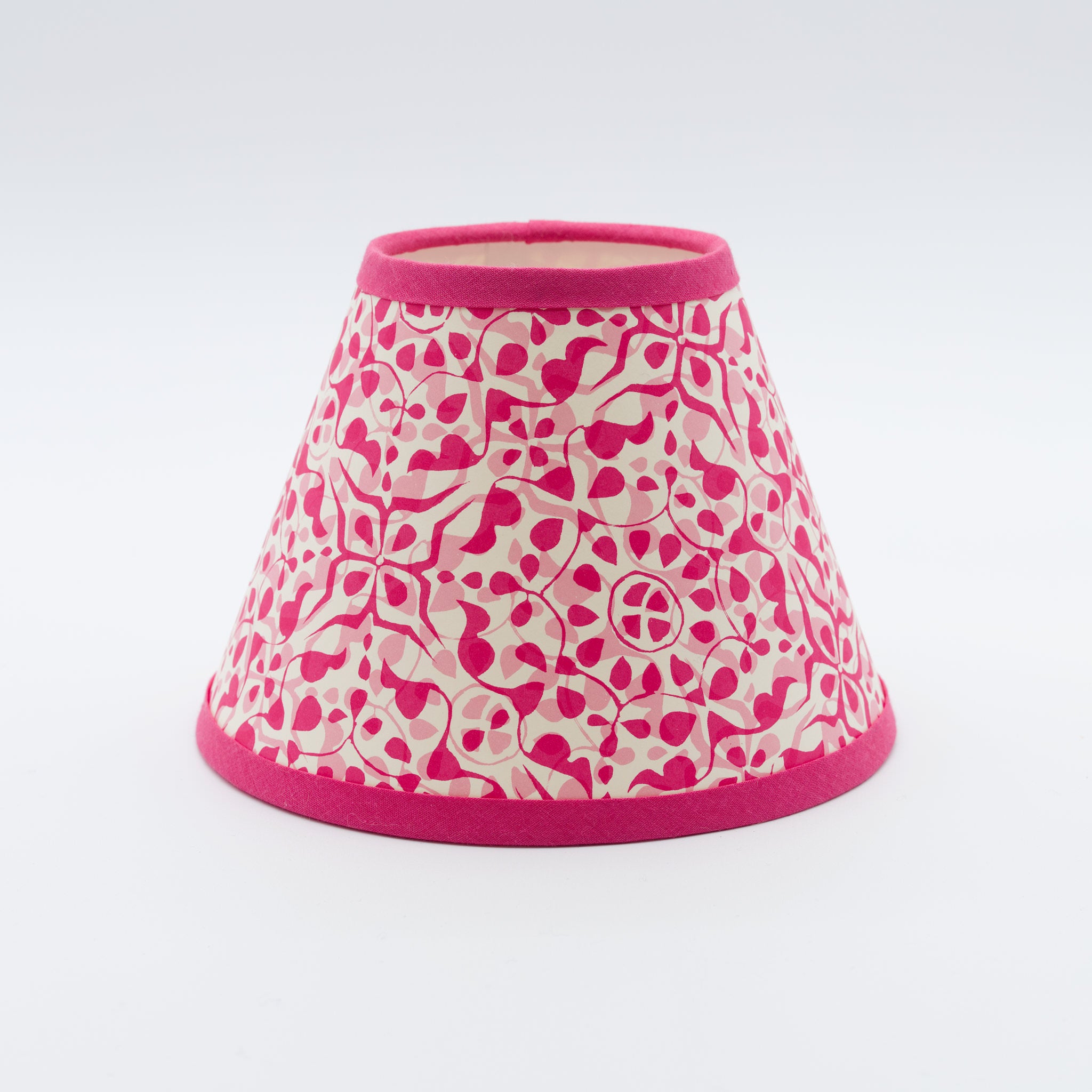 Dappled Pink lampshade — soft dappled spot texture in pink on a handmade conical paper shade.