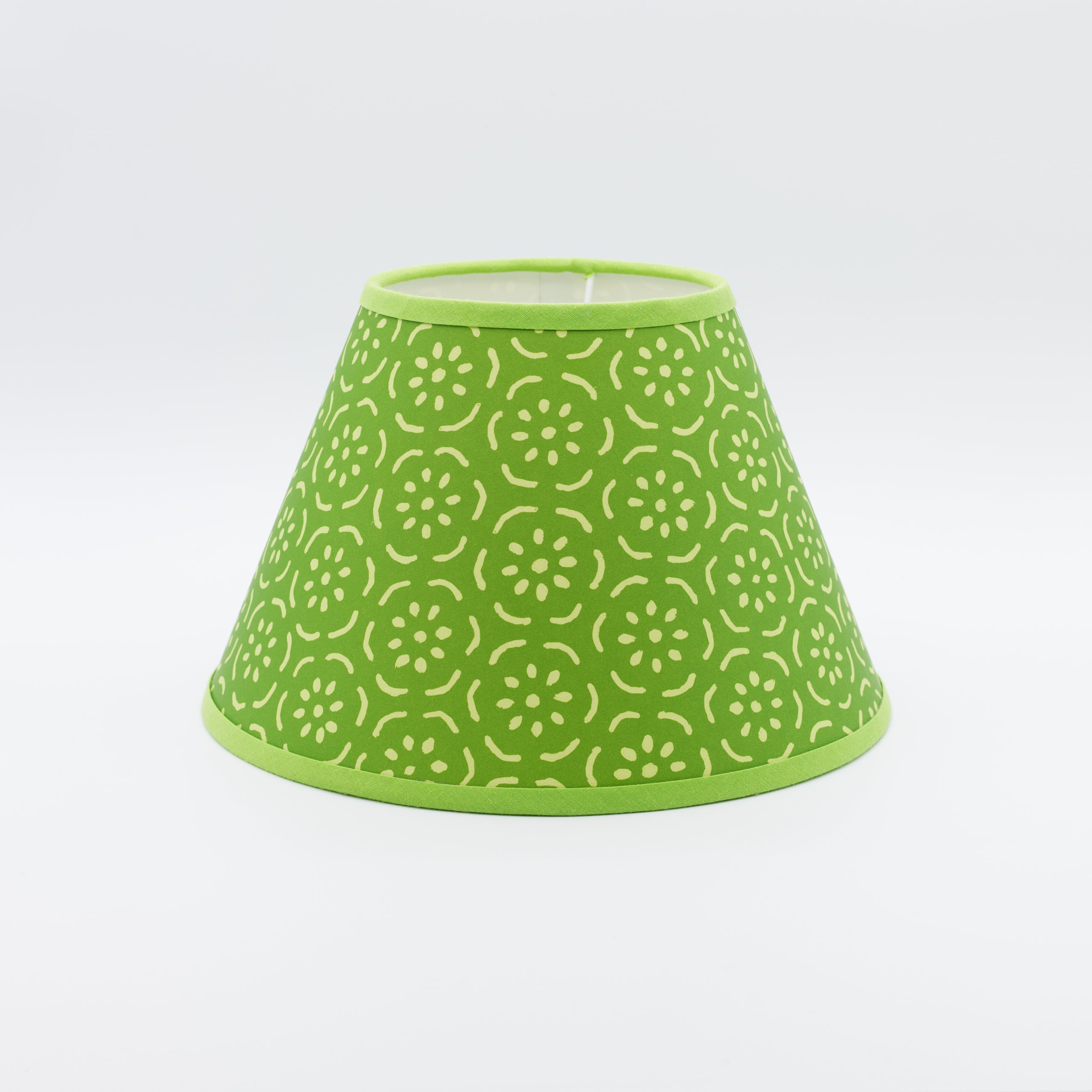 Pear Halves lampshade in grass green — halved-pear motif on a handmade conical paper shade.