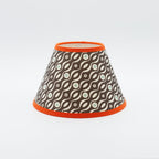 Persephone lampshade in brown — small floral sprig pattern on a handmade conical paper shade.