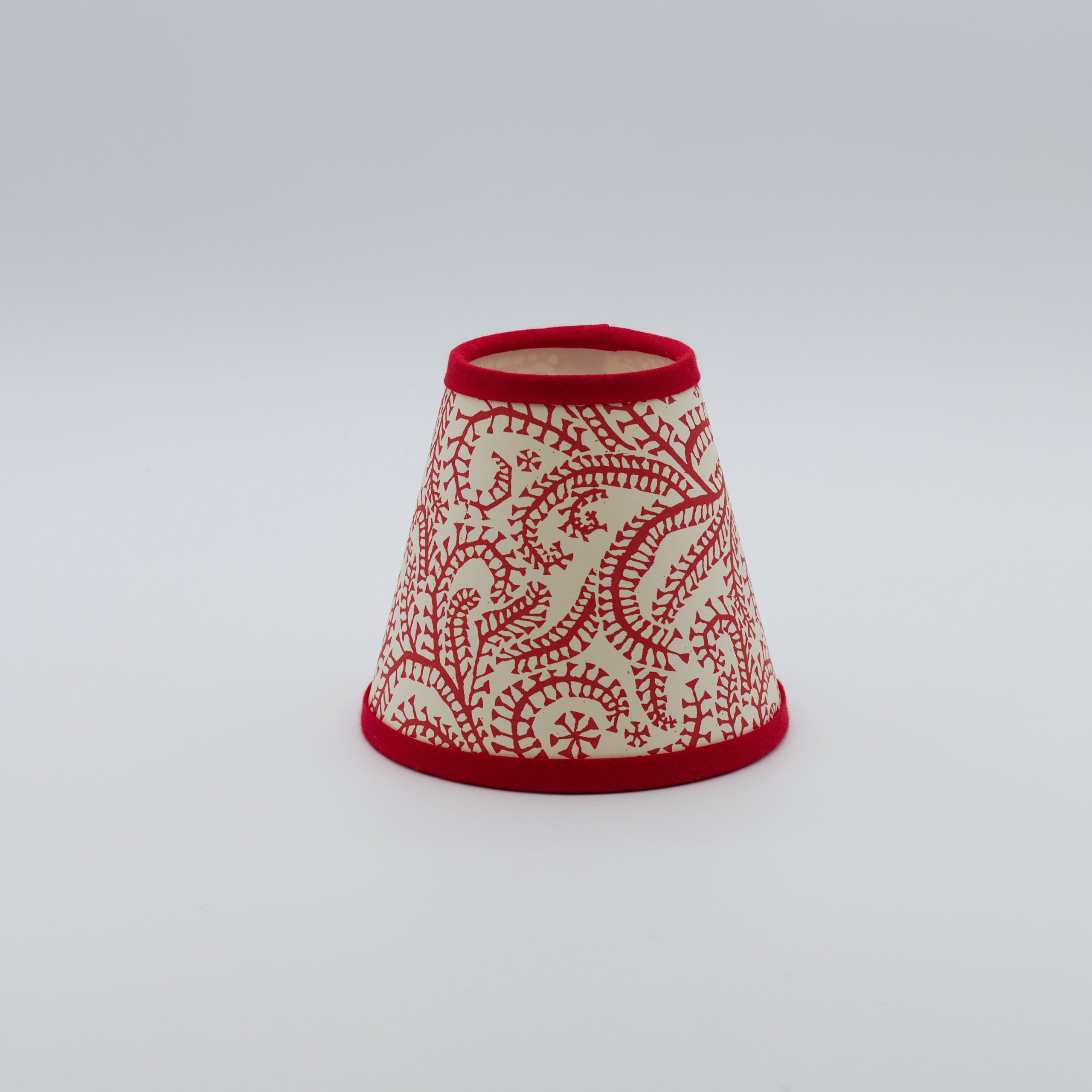 Seaweed Crimson Paisley lampshade — crimson paisley seaweed pattern on a conical paper shade.