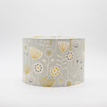 Seedheads lampshade in grey and yellow — botanical seedhead pattern on a cotton drum shade.