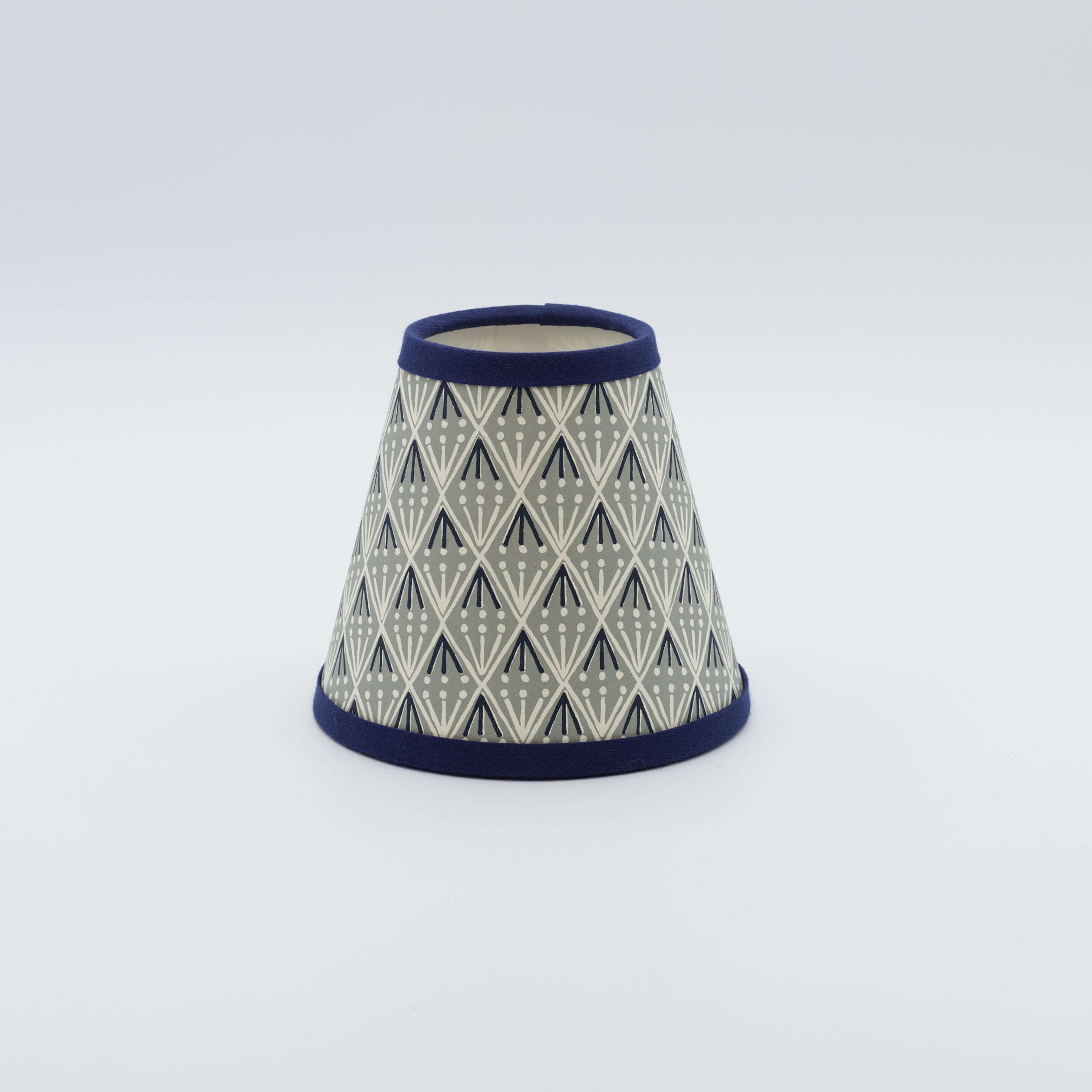 Selvedge Indigo lampshade — indigo selvedge-stripe pattern on a handmade conical paper shade.