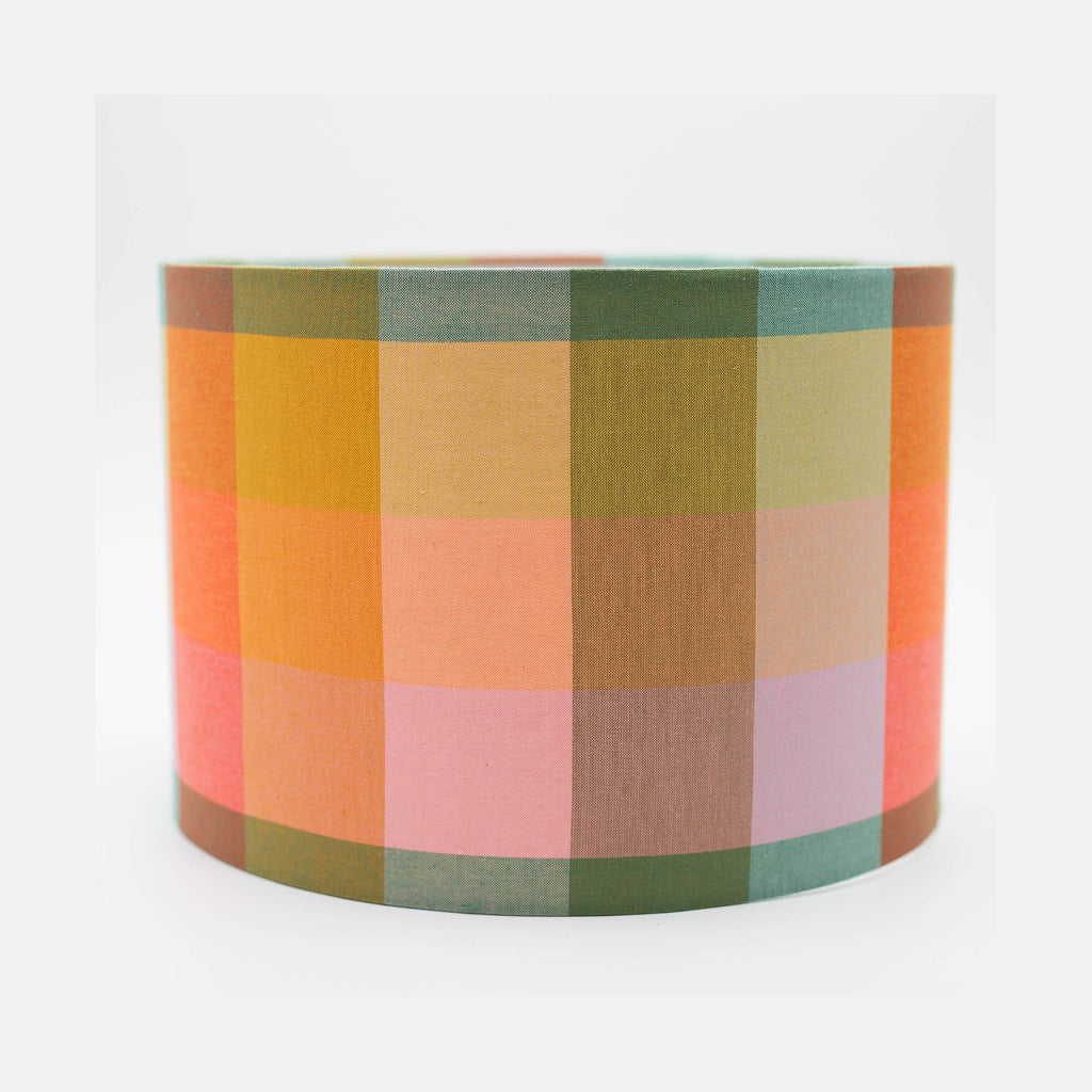 Spring Squares lampshade — pastel pink and blue geometric check on a cotton drum shade.