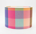 Summer Squares lampshade — bright pink and blue geometric check on a cotton drum shade.