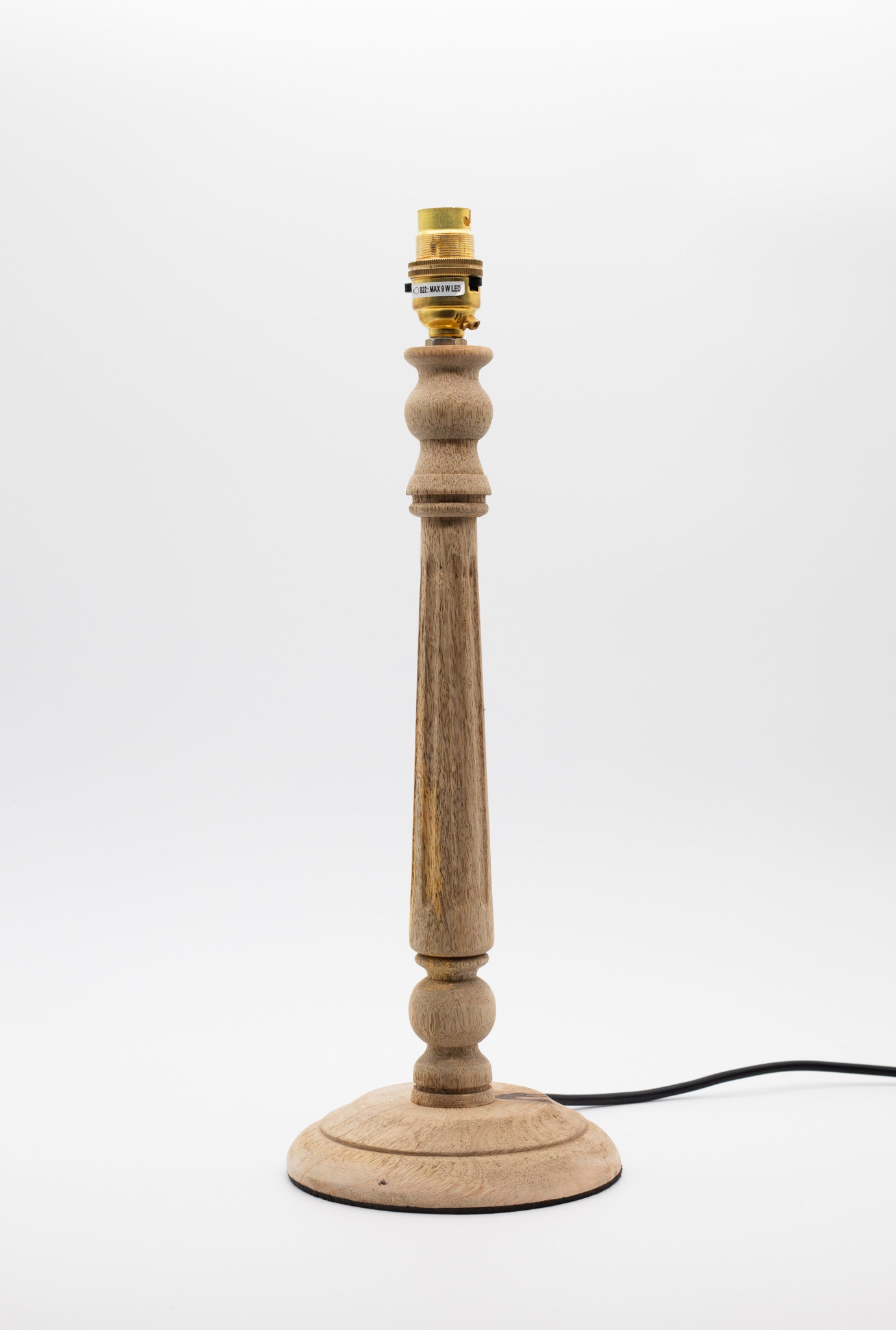 Fluted wooden table lamp base, turned from natural wood with a fluted column.