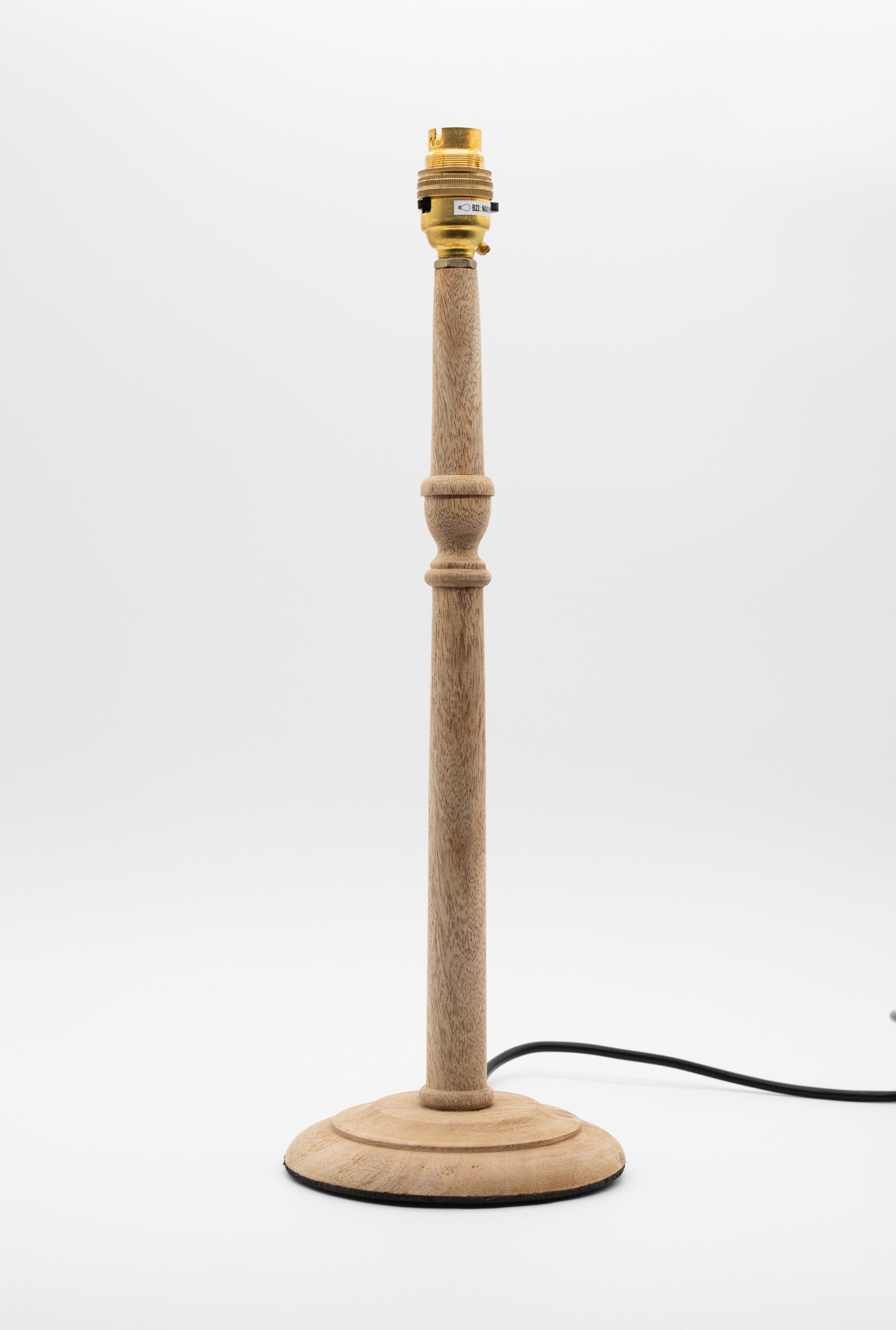 Tall, slender turned wooden table lamp base in natural mango wood.